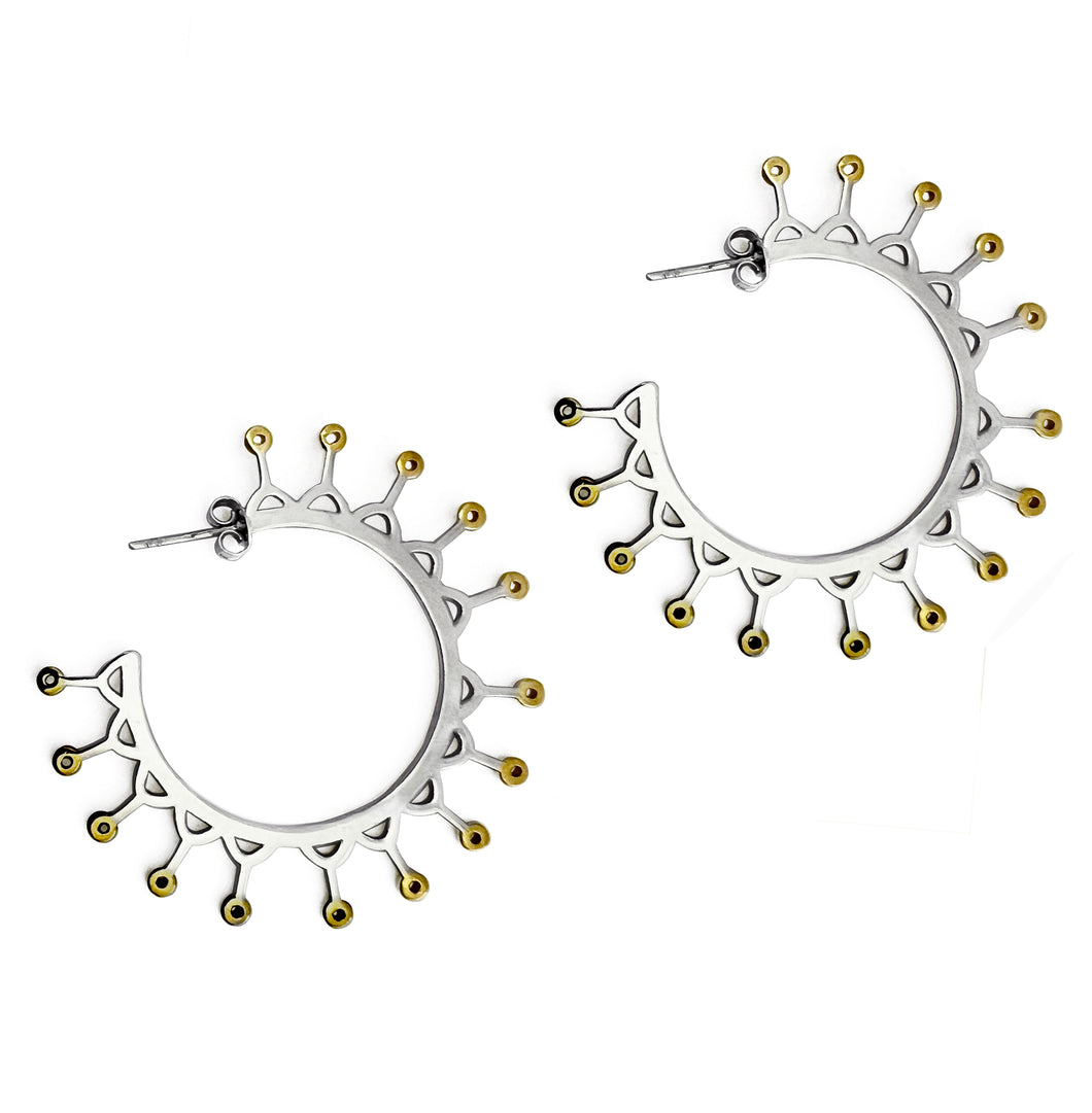 Silver hoop crown earrings with yellow gold plated spikes.