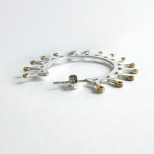 Load image into Gallery viewer, Silver hoop crown earrings with yellow gold plated spikes.
